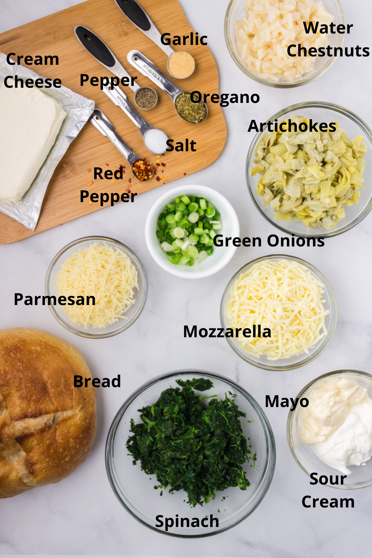 ingredients for spinach artichoke dip on a table