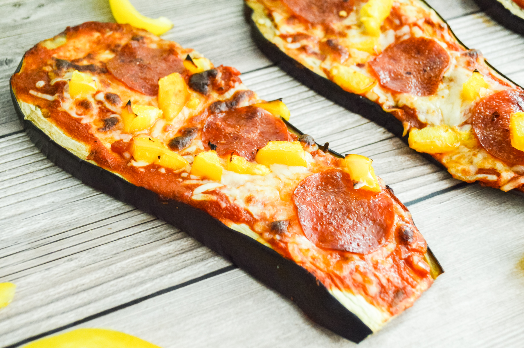 Air Fryer Eggplant Pizza Slices on a wooden cutting board